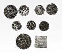 A Indian silver temple token and a selection of Islamic probably Mughal silver coins comprising a
