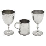 A late 19th century Indian colonial presentation silver trophy cup and a silver half pint mug