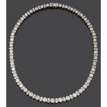 An impressive diamond necklace, flexible graduated row of 46 brilliant-cut diamonds, Harrods, London