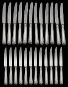 Set of silver handled thread and shell pattern stainless steel bladed table and dessert knives