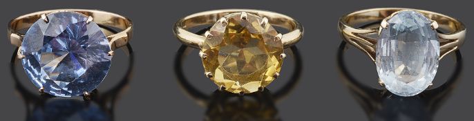 A 9ct gold mounted citrine dress ring and two others