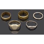Two 22ct gold wedding bands and three other gold rings