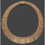 A Continental 18ct gold Egyptian style fringe necklace