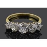 An attractive five stone graduated diamond set ring