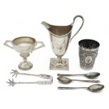 A modern silver helmet shaped cream jug in George III style, a German .800 beaker and other silver