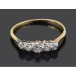 A delicate five stone graduated diamond set ring