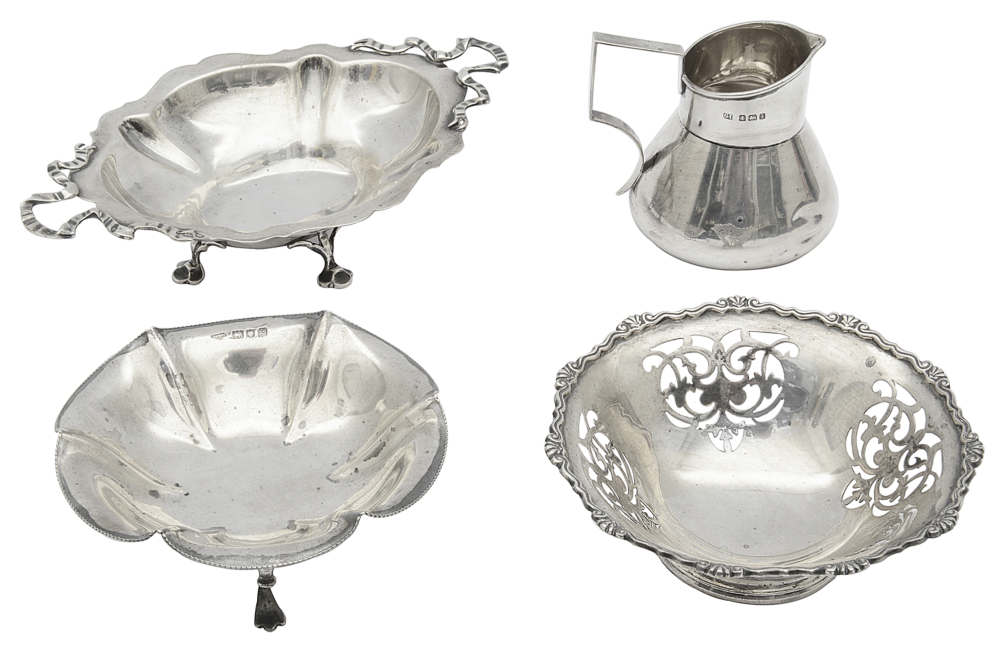 Two Edward VII and one later silver bonbon dishes and an Edward VII silver milk jug