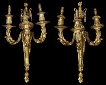 A pair of 19th century French Louis XVI style ormolu three light wall appliques