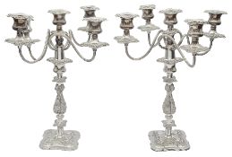 A pair of mid 20th silver plated five light candelabra in late Georgian style