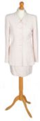 A pale pink Chanel skirt suit