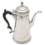 A George V silver coffee pot in George II style