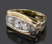 An Art Deco style Continental three stone diamond panel set ring