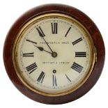 An early 20th century small oak cased circular drop dial wall clock