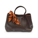 An Hermes Chocolate Veau Swift leather Garden Party bag