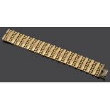 A Continental 18ct gold wide fancy articulated bracelet