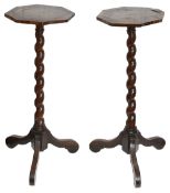 A pair of William and Mary burr walnut, oak and parquetry candlestands