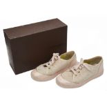 A pair of Louis Vuitton pale pink and gold monogrammed trainers