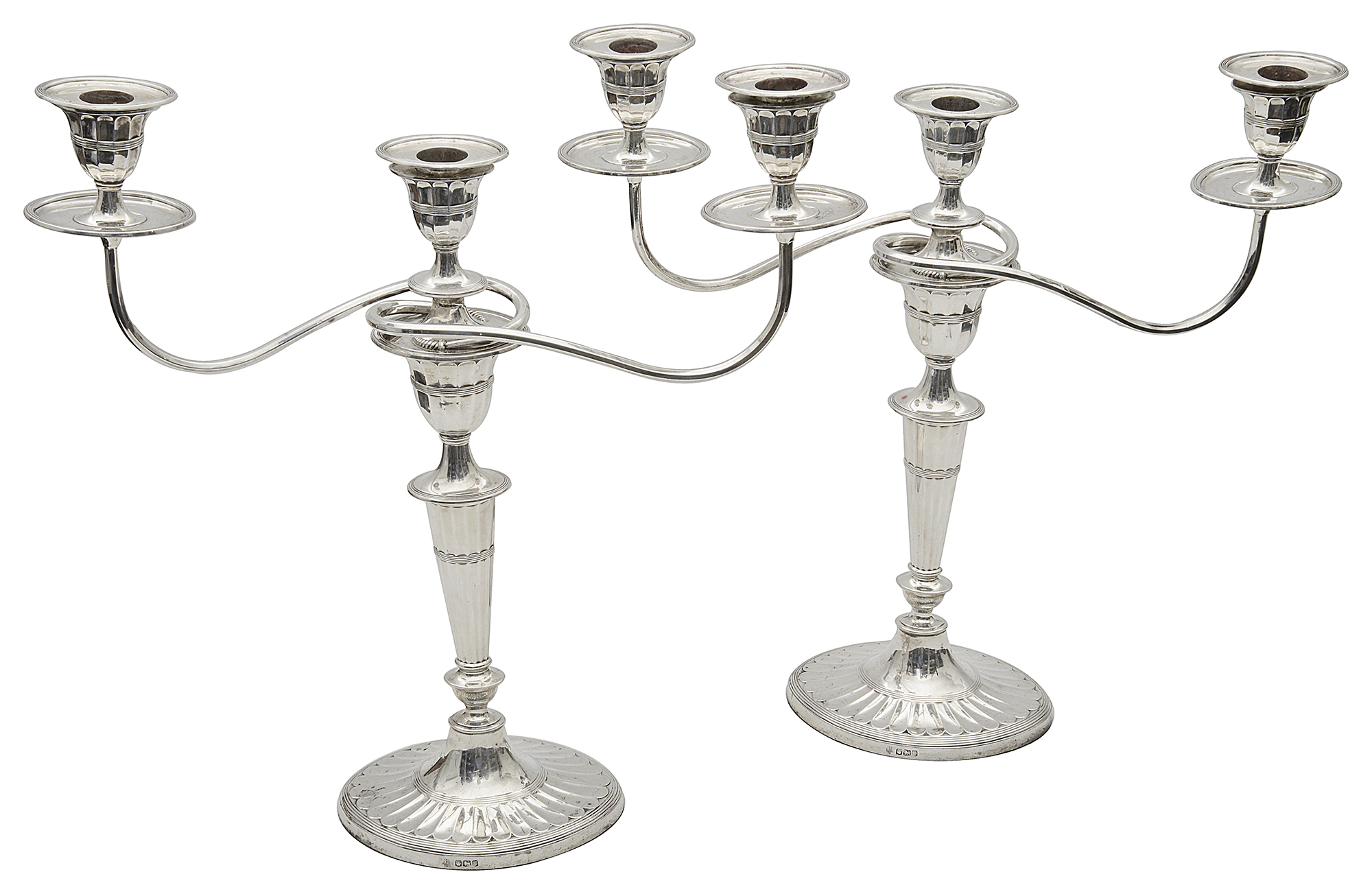 A pair of George V silver neo-classical design three light candelabra