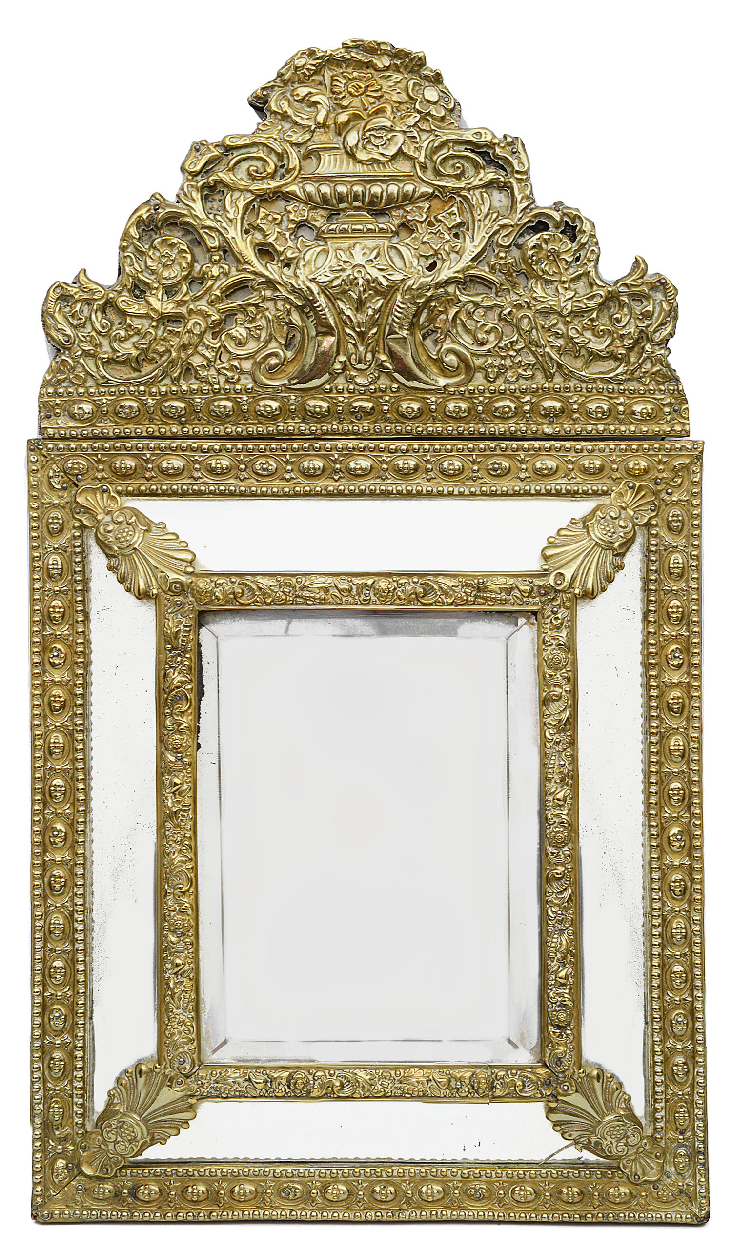 A 19th century Flemish embossed brass cushion wall mirror in 17th century style