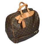 A Louis Vuitton monogrammed travel bag