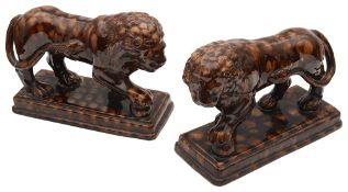 A pair of 19th century Staffordshire treacle glazed Medici lions