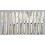 A set of twelve silver handled shell and thread pattern fish knives and forks