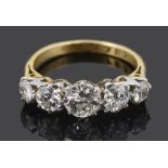 A five stone diamond set five stone half hoop ring