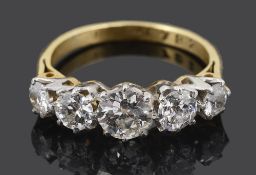 A five stone diamond set five stone half hoop ring