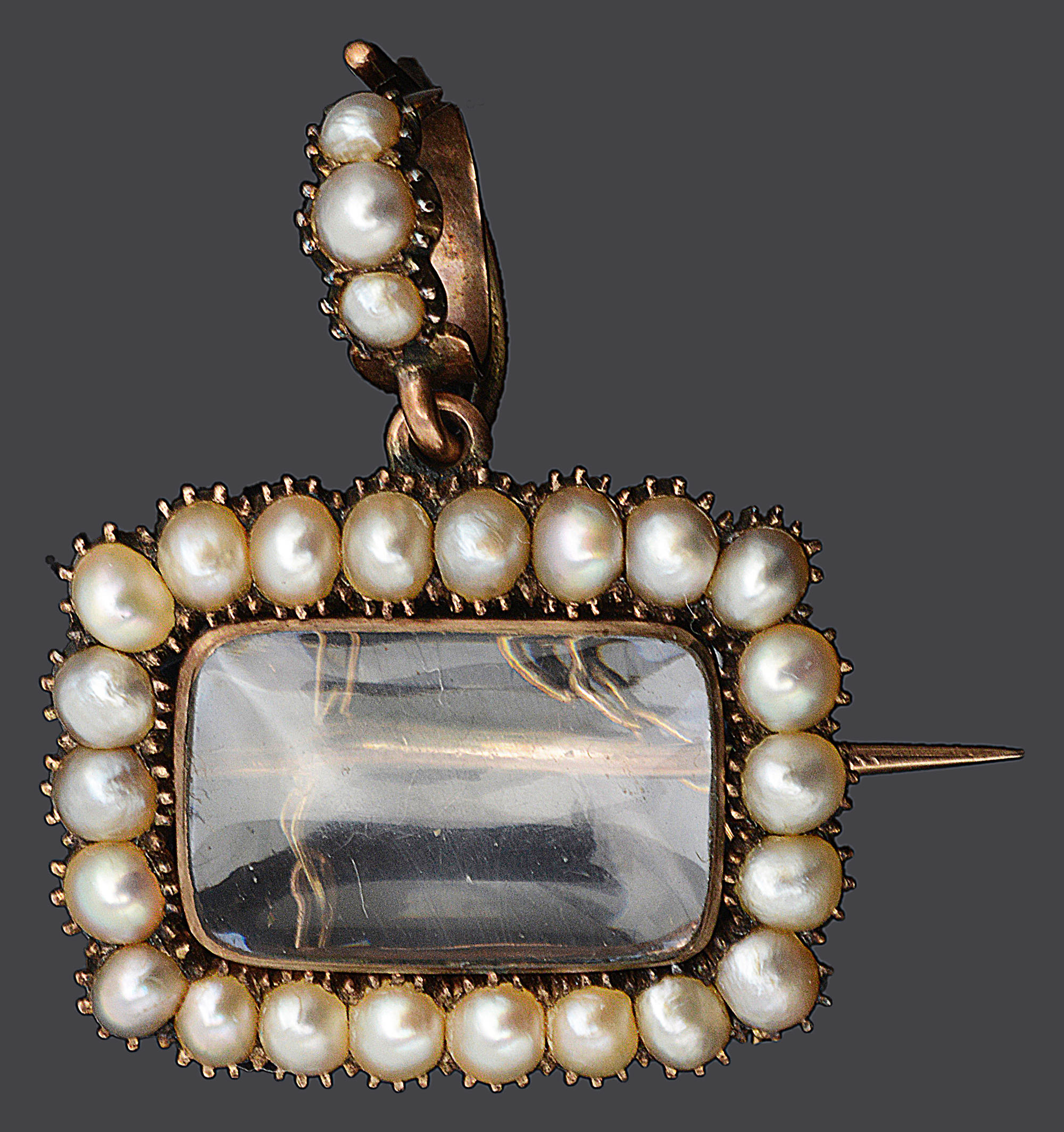 A Georgian half pearl framed memorial locket/brooch