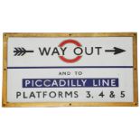 A c.1930s London Underground enamel direction sign showing 'WAY OUT / AND TO / PICCADILLY LINE /