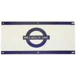 A London Underground enamel station frieze sign for 'PICCADILLY LINE',blue edging and roundel on