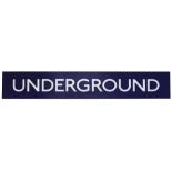 A London Underground sign displaying 'UNDERGROUND'