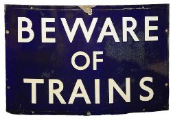 A BR(E) enamel sign displaying 'BEWARE OF TRAINS',with white lettering on a blue groundheight 45.