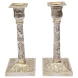 A pair of late 19th century Indian Colonial silver candlesticks