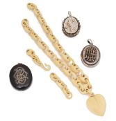 A Victorian carved ivory heart pendant necklace and three lockets