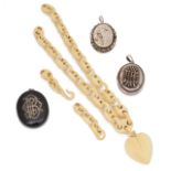 A Victorian carved ivory heart pendant necklace and three lockets