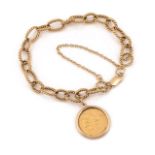A 9ct gold bracelet with half sovereign pendant