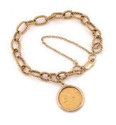 A 9ct gold bracelet with half sovereign pendant