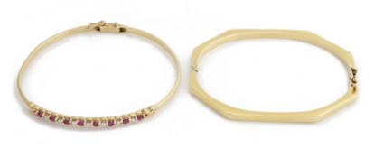 A delicate ruby and diamond set bangle and another bangle