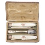 A Georgian silver and mother of pearl folding knife and fork and silver spoon travelling set