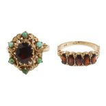 Two 9ct gold mounted garnet set dress rings