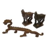 A Chinese bronze figure of a standing dragon and two Tang style bronze horses, (3)
