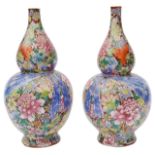 A pair of Chinese famille rose millefleur double gourd vases