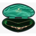 An Edwardian 15ct pearl set necklace in fitted case