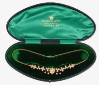 An Edwardian 15ct pearl set necklace in fitted case