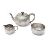 A late Victorian silver three piece bachelors tea service