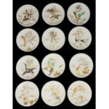 A set of eleven Aesthetic Movement dessert plates and a comport top by E.J.D. Bodley, Burslem,