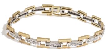 A 9ct white and yellow gold diamond set fancy link bracelet