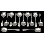 A matched set of twelve Edward VII / George V silver fiddle pattern soup spoons