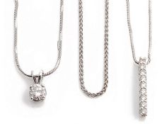 A contemporary single stone diamond set pendant